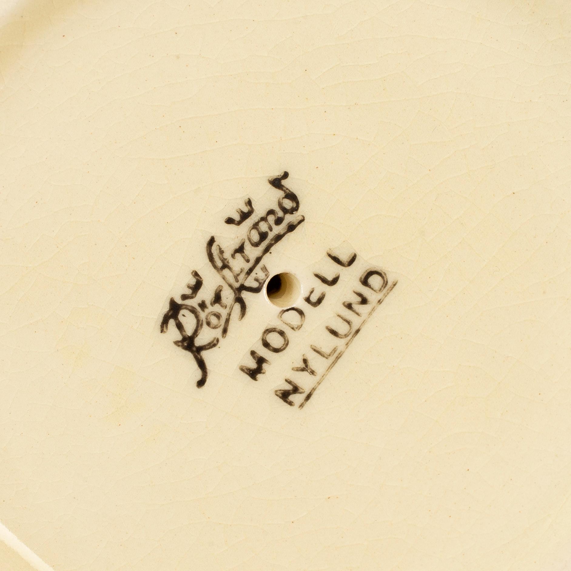 a set of 6 "Nylund" candlesticks, Gustavsberg, first half of the 20th century.