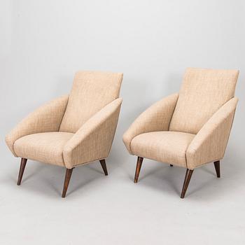 A pair of 1950s armchairs.