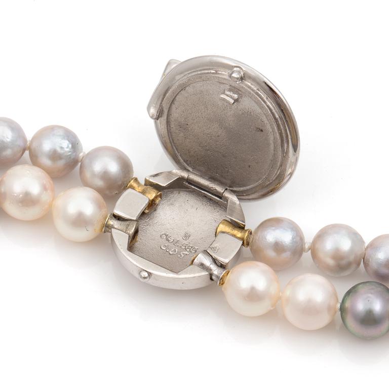 A Ole Lynggaard cultured freshwater pearl necklace. Clasp set with a cultured mabé pearl and a brilliant cut diamond.