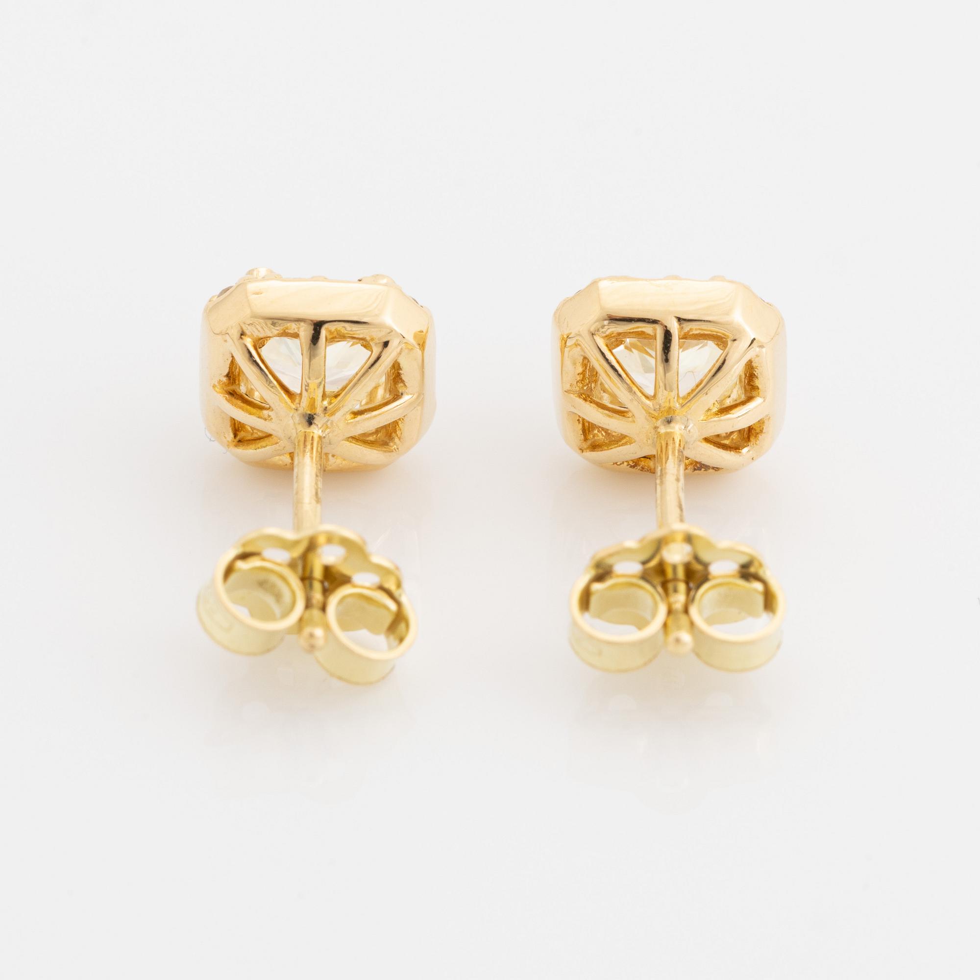 Light yellow diamond earrings.