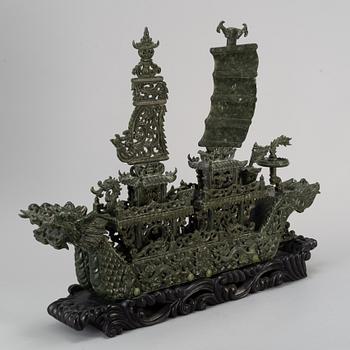 A large Chinese green stone carved sculpture, 20th century.