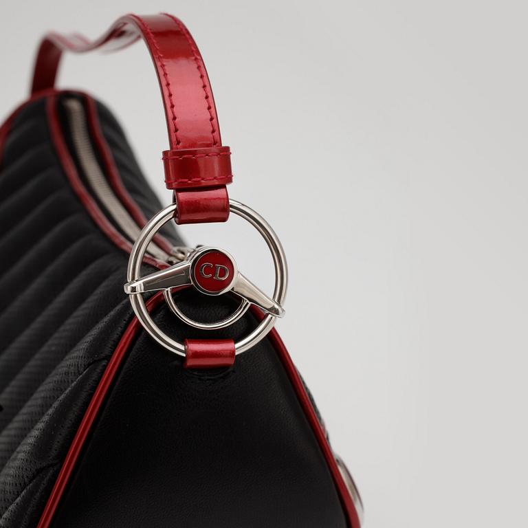 CHRISTIAN DIOR, a black leather shoulder bag with red patent details, "Montaigne Chris 1947".