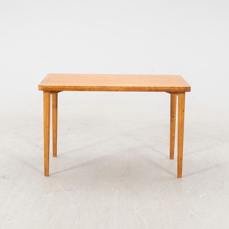 A 1940s birch side table.