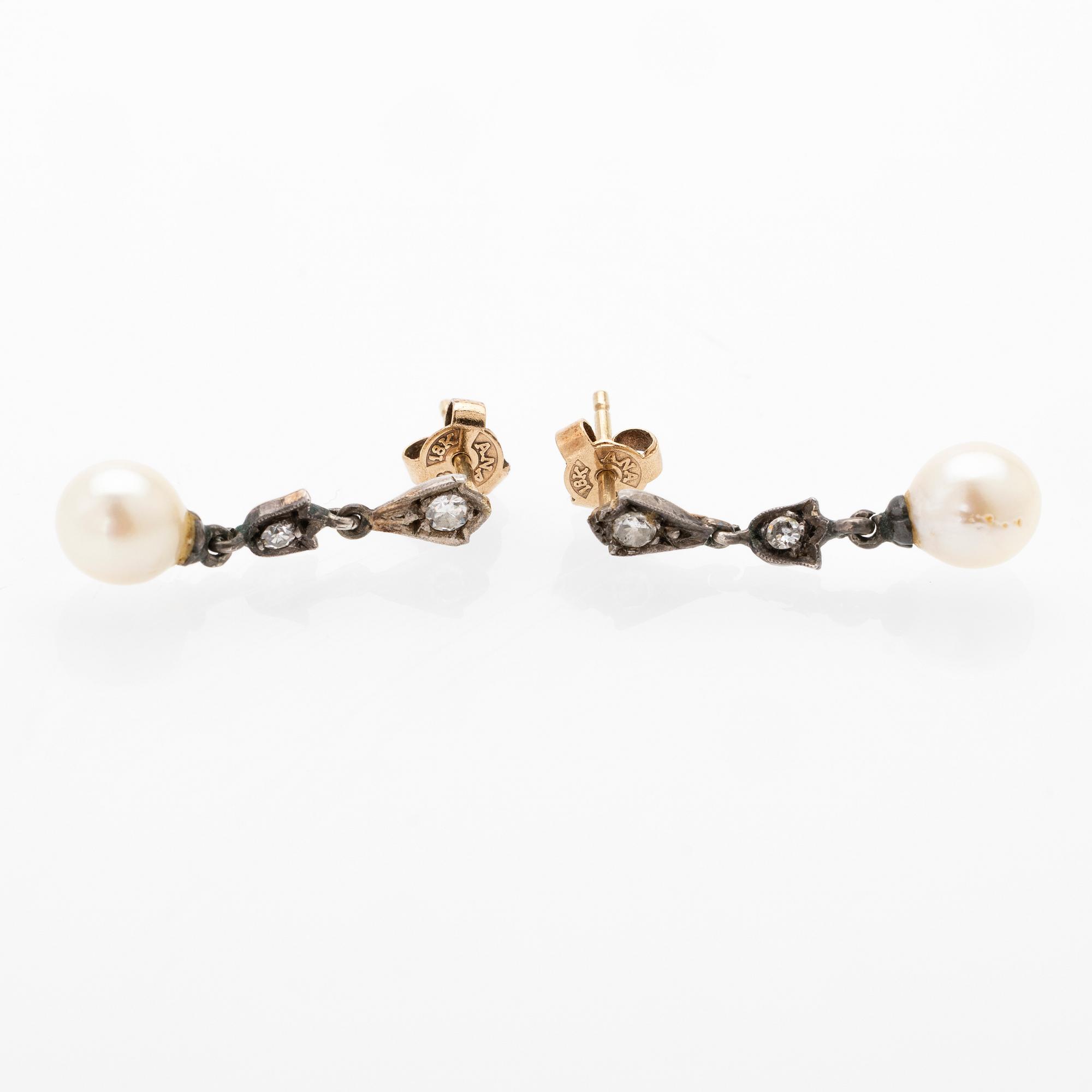 Earrings, a pair, 18K gold and silver with diamonds and cultured pearls.