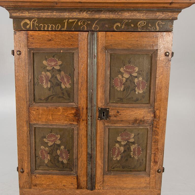 An oak cabinet dated 1786.