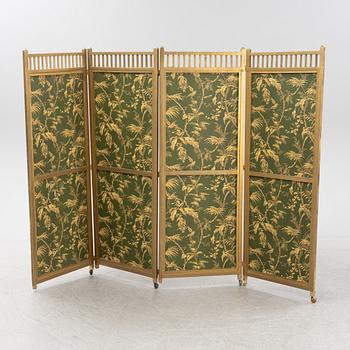 A 20th Century folding screen.