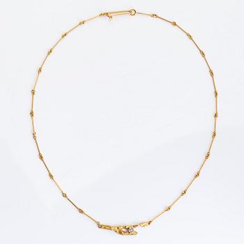 Björn Weckström, An 18K gold necklace "Diamondbud" with an eight-cut diamond ca 0.02 ct. Lapponia 1982.