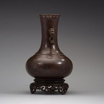 A bronze vase with stand, Qing dynasty (1644-1912).