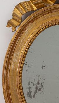 A pair of late Gustavian one-branch giltwood girandole mirrors, Stockholm, circa 1800.