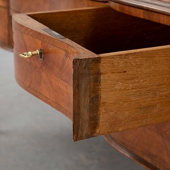 A Rococo-style circa 1900 writing desk.