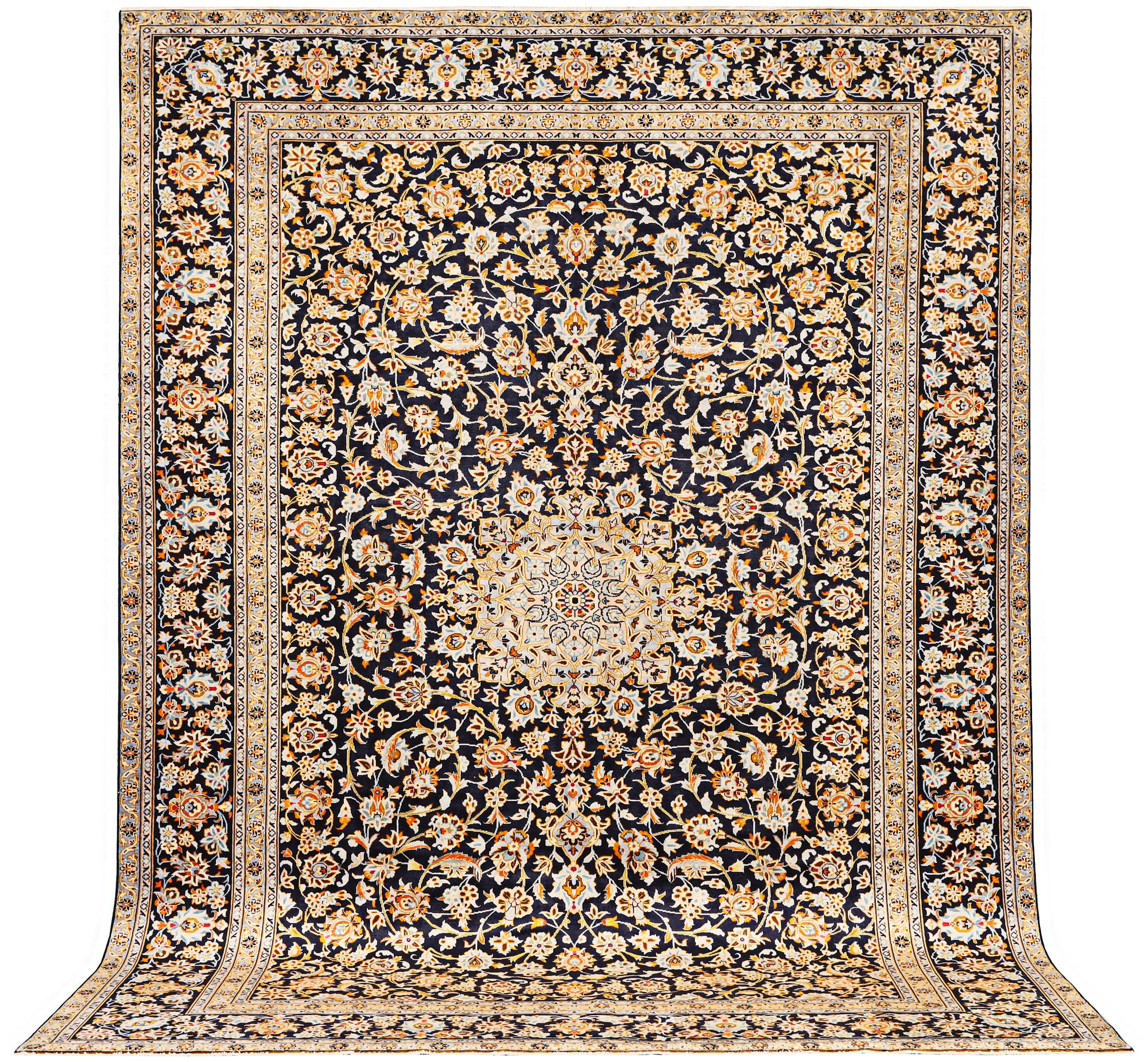 A Kashan carpet, a. 405 x 290 cm.