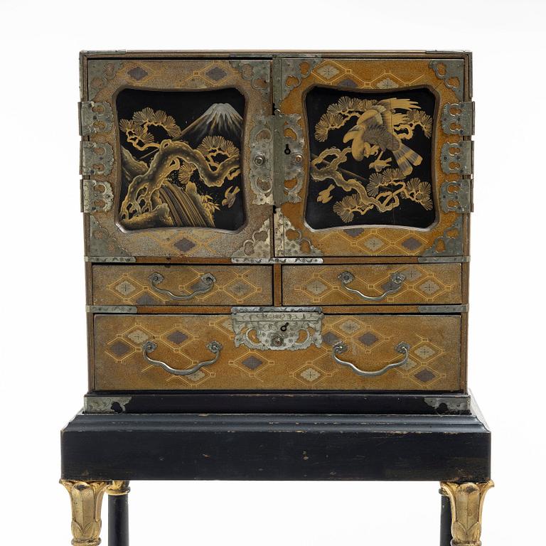 A maki-e cabinet on stand, Japan, 19th century.