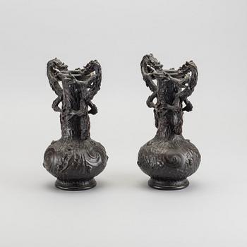 A pair of 20th century bronze vases.