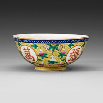 100. A famille rose yellow ground bowl, Qing dynasty, Guangxu six-character mark and of the period  (1875-1908).