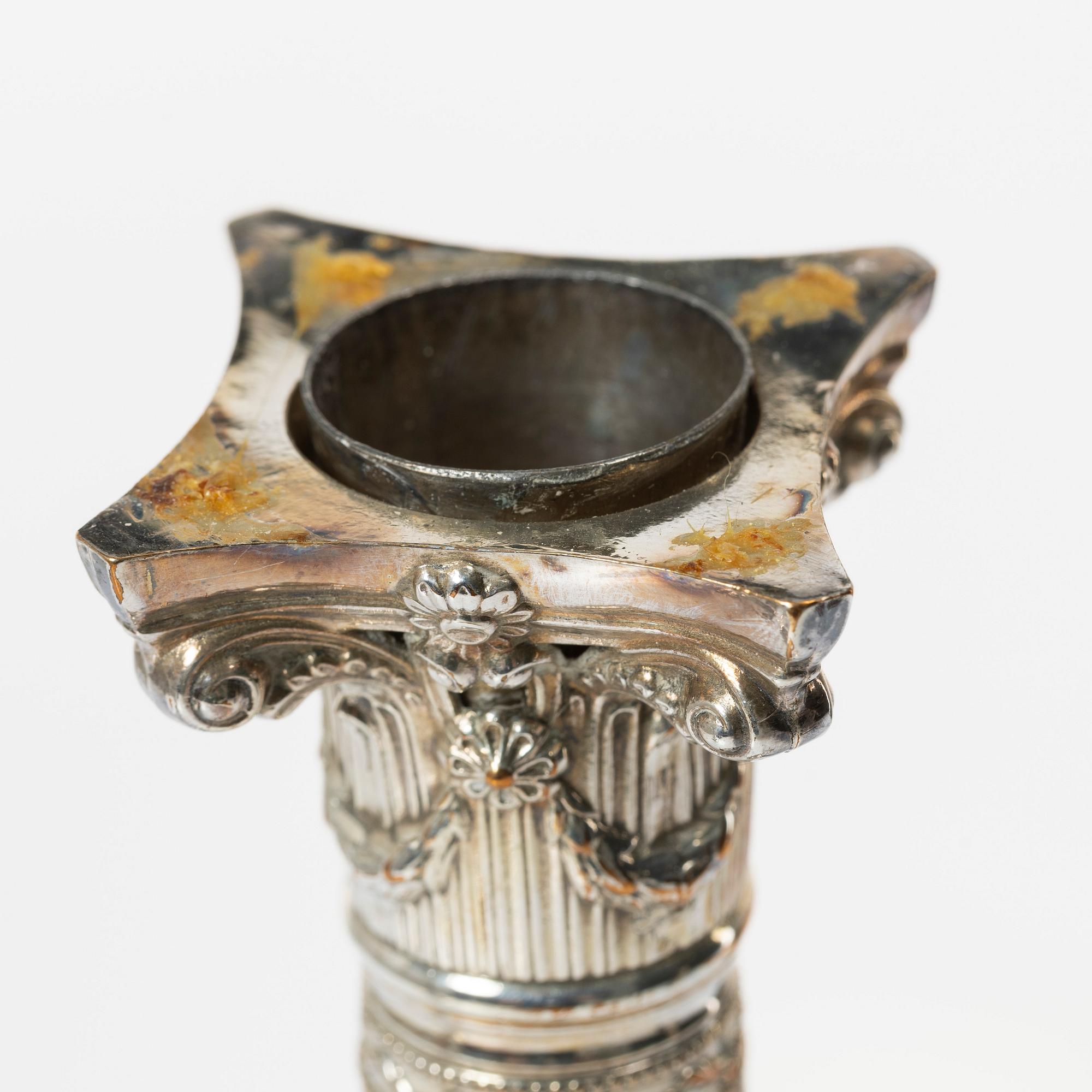 Four silver plated candlesticks, early 20th century.