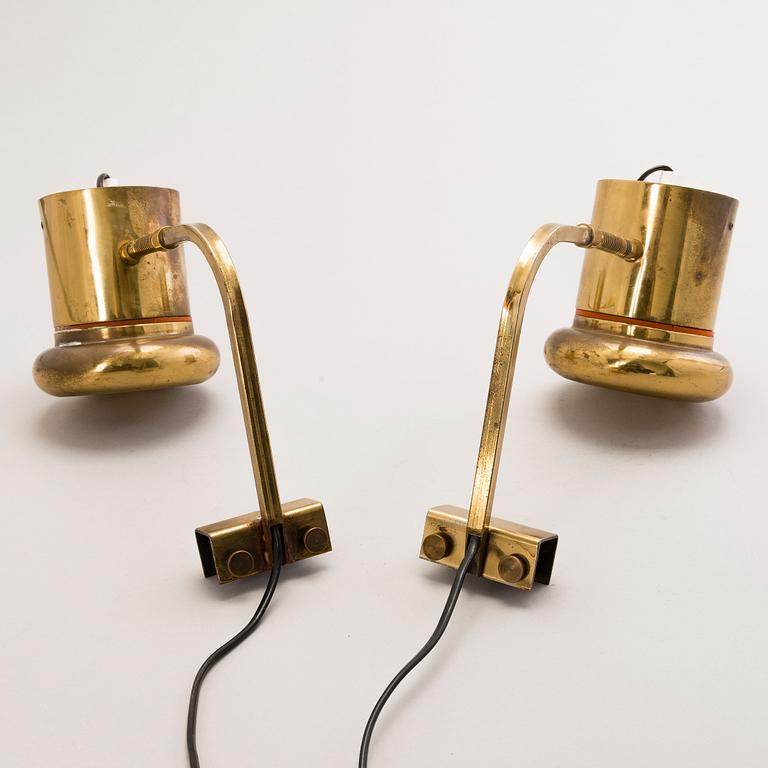 KAI RUOKONEN, A pair of brass wall lamps.