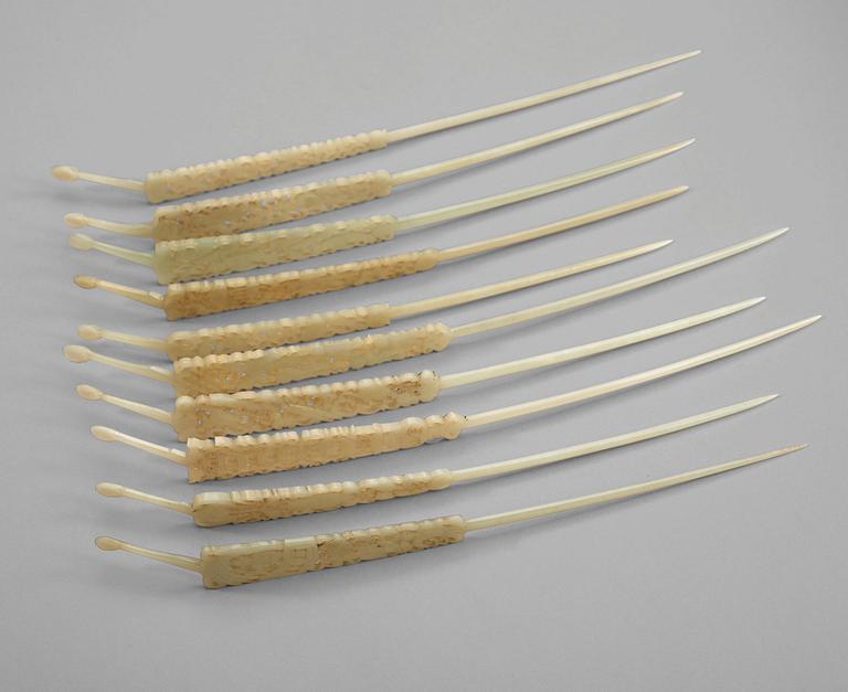 A set of ten carved pale celadon nephrite hairpins, late Qing dynasty (1644-1912).