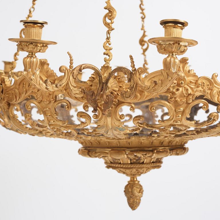 A rococo-revival gilt-brass sixteen-light chandelier, mid 19th century.