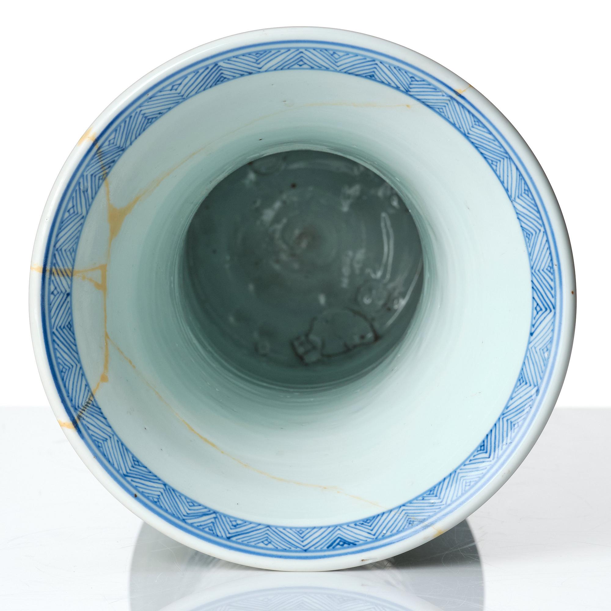 A Chinese blue and white celadon-ground beaker vase, Qing dynasty, Kangxi (1662-1722).