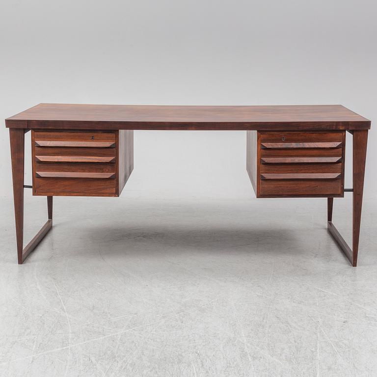 A 1960's rosewood desk by Kai Kristiansen, Feldballes Møbelfabrik, Denmark.