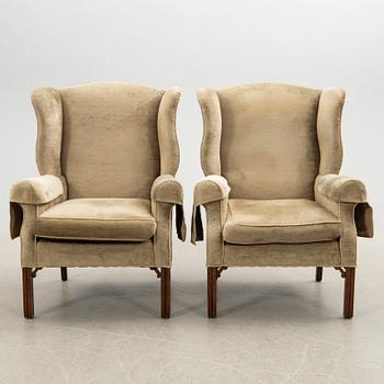 Ear flap armchairs, a pair, England, second half of the 20th century.