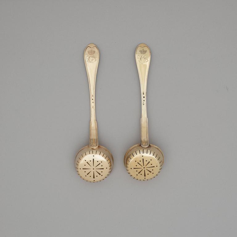 A pair of Swedish 19th century silver-gilt sugar-spoons, makers mark of Gustaf Folker, Stockholm 1824.