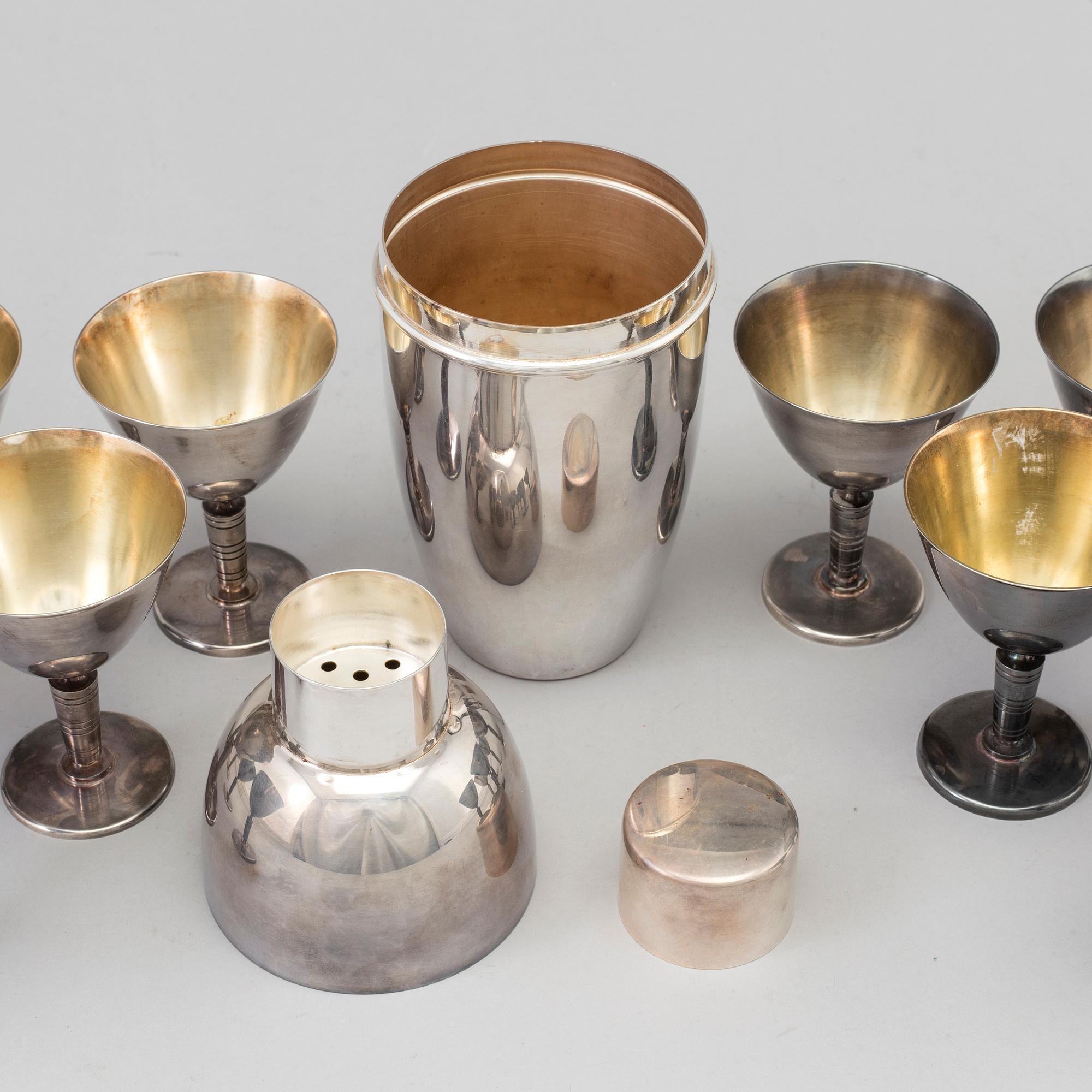 A silverplated shaker and 12 cocktail glasses from GAB and and a Shaker from CG Hallberg, Stockholm mid 20th century.