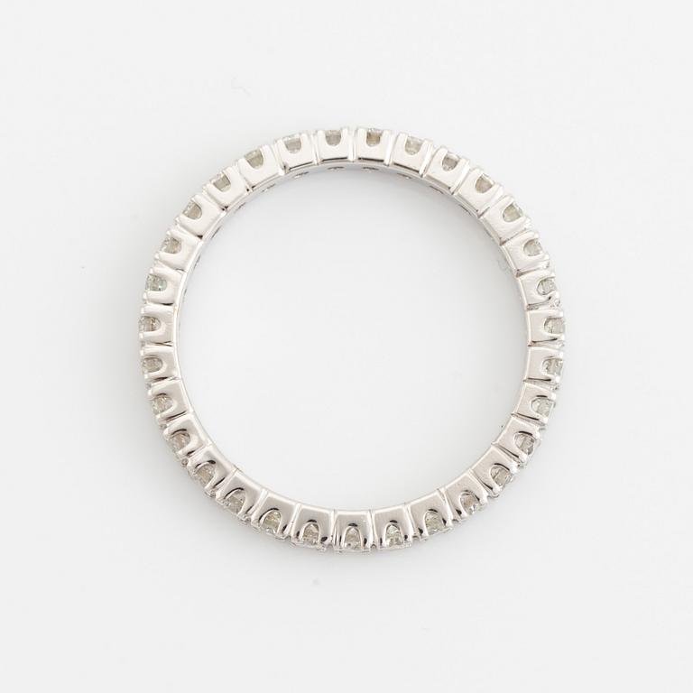 Brilliant cut diamond eternity ring.