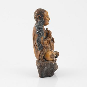 A soapstone sculpture of a lohan, late Qing dynasty.