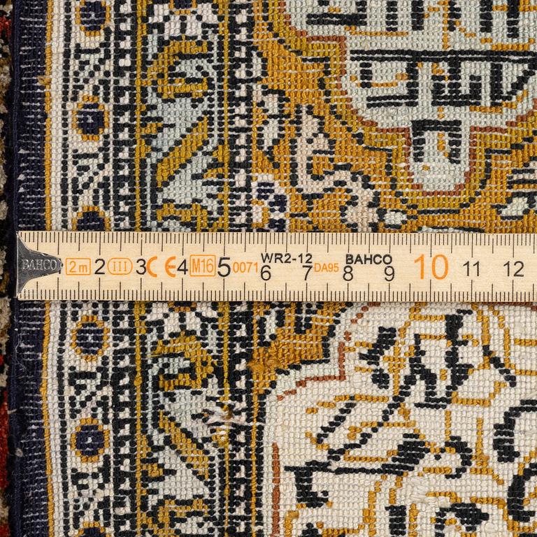 A silk Qum rug, c. 172 x 105 cm.