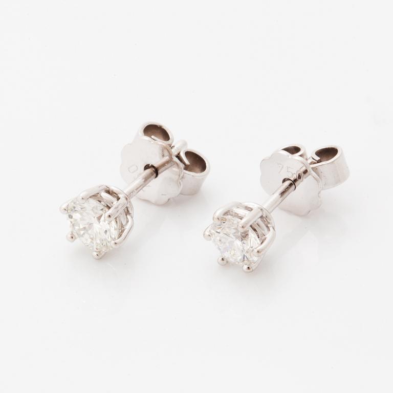 Brilliant-cut diamond stud earrings.