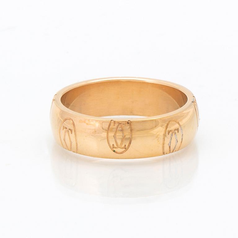 An 18K gold ring "Logo de Cartier" by Cartier.