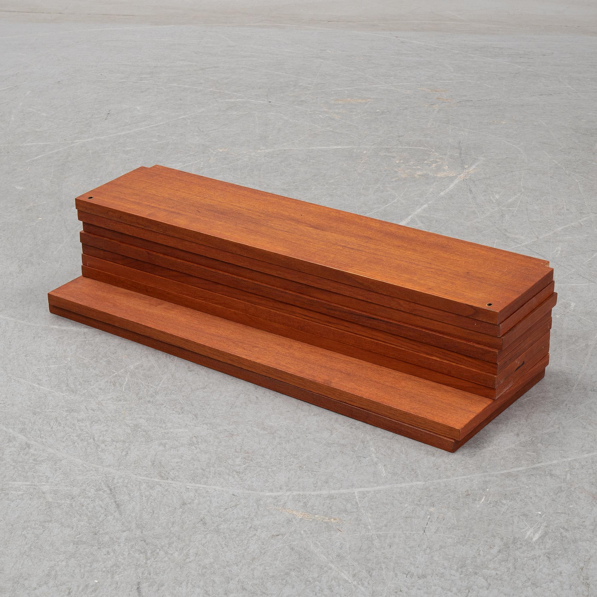 A 1960's teak shelving system by Poul Cadovius.