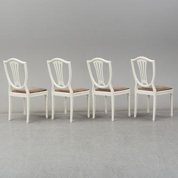 A dining table and four chairs, Gustavian style, second half of the 20th century. One leaf included.