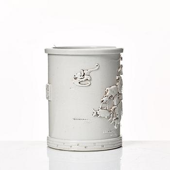 A white glazed Chinese brush pot, presumably late Qing dynasty.