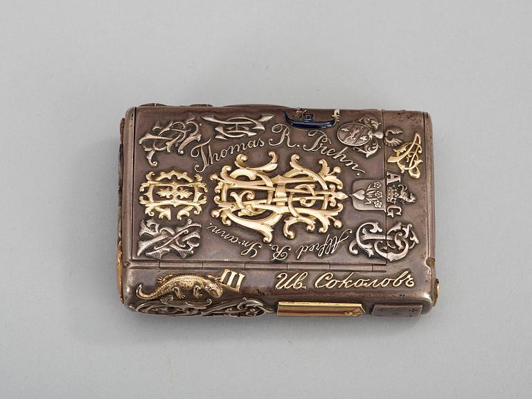 A CIGARRETTE Russian 19th century parcel gilt and enameld cigarette-case, makers mark of Michael Isakov, S.t Petersburg.