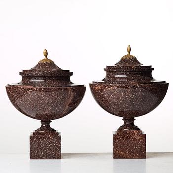 A pair of late Gustavian early 19th century porphyry urns with cover.