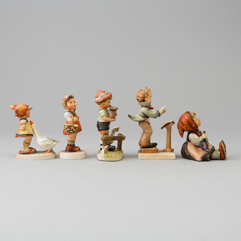 Five porcelain figurines, mostly Goebel.