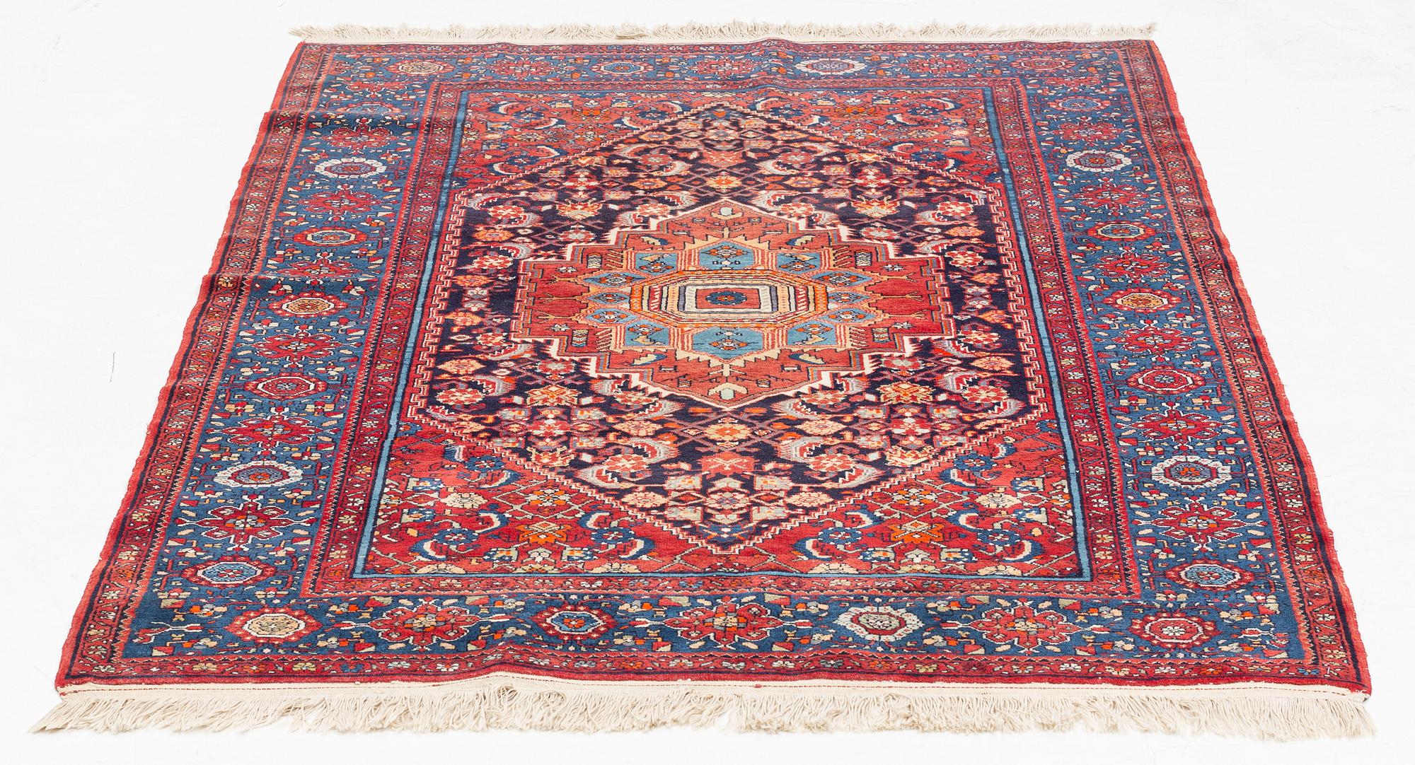 An oriental rug, old, c. 204 x 139 cm.