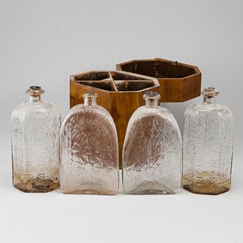 A gustavian style mahogany box with 4 glass bottles, circa 1900.