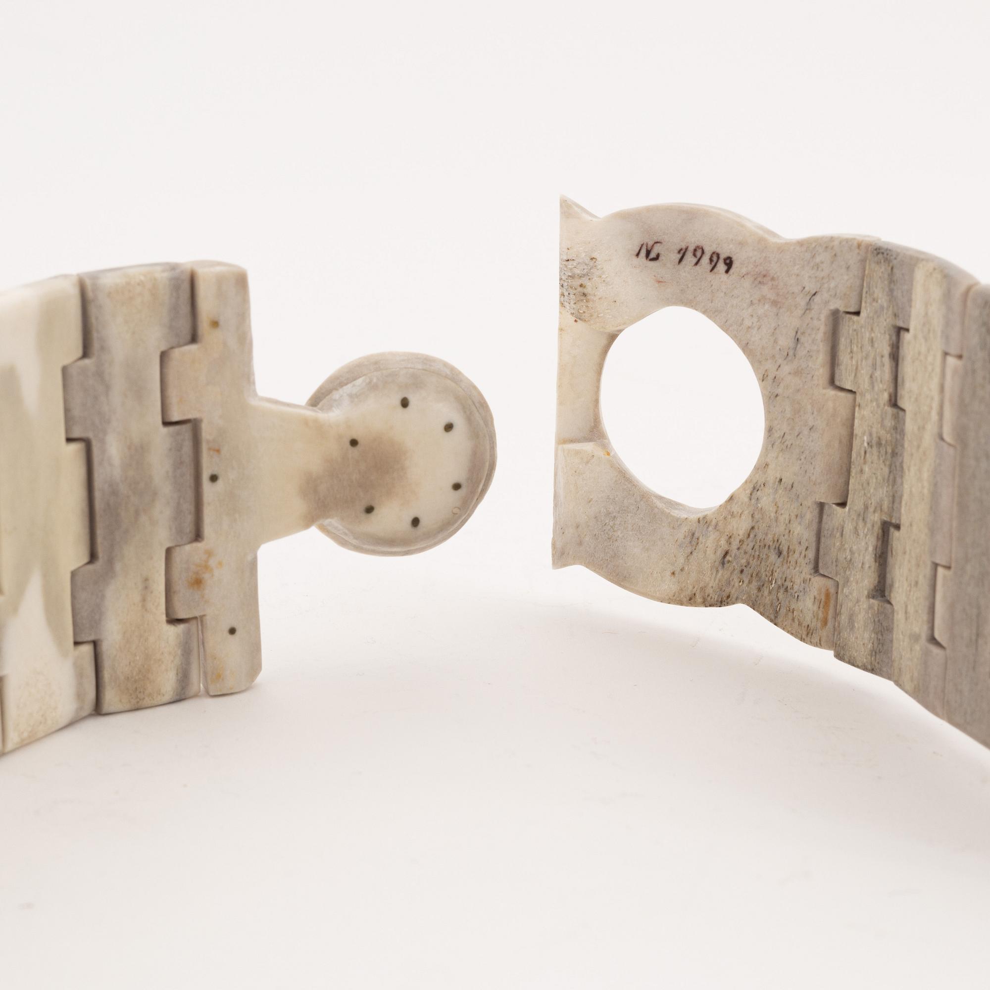 A reindeer horn belt by Gunnar Svonni, signed and dated 1999.