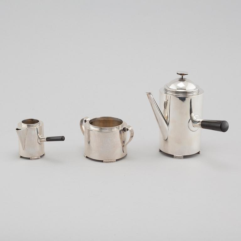 A silver coffee pot, a creamer and a sugar bowl by C F Carlman in Stockholm, 1937 and 1945.