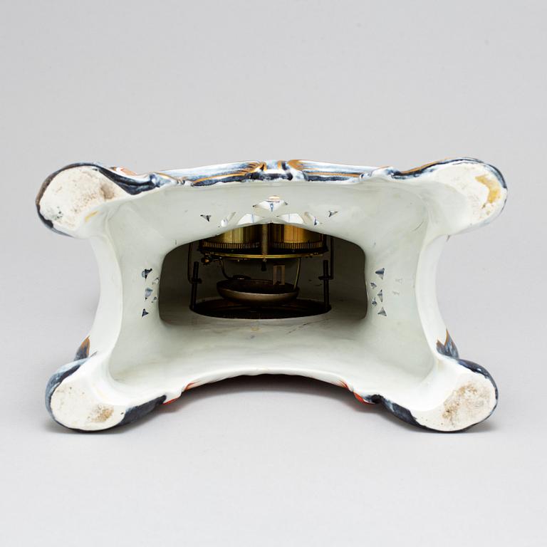 A new rococo creamware bracket clock, after Meissen model, early 20th century.