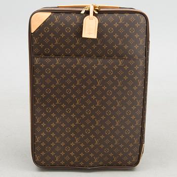 A Monogram Canvas Pégase 65 Suitcase with a Protective Cover.