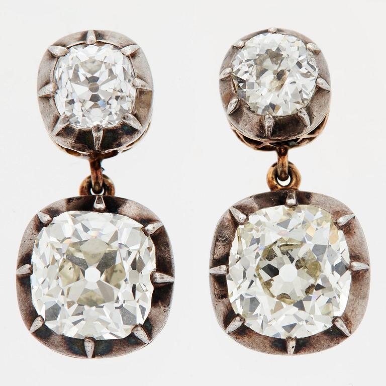 A PAIR OF EARRINGS set with four old-cut diamonds.