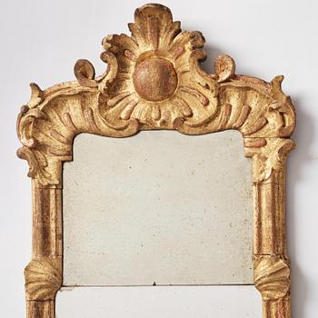 A pair of rococo giltwood two-branch girandoles, Stockholm, later part 18th century.