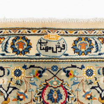 A carpet, Kashan, signed ca 340 x 248 cm.