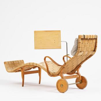 Bruno Mathsson, a lounge chair with wheels, Firma Karl Mathsson, Värnamo, 1940s, with reading table from 1972.