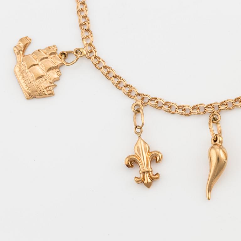 Bracelet, 18K gold with charms.