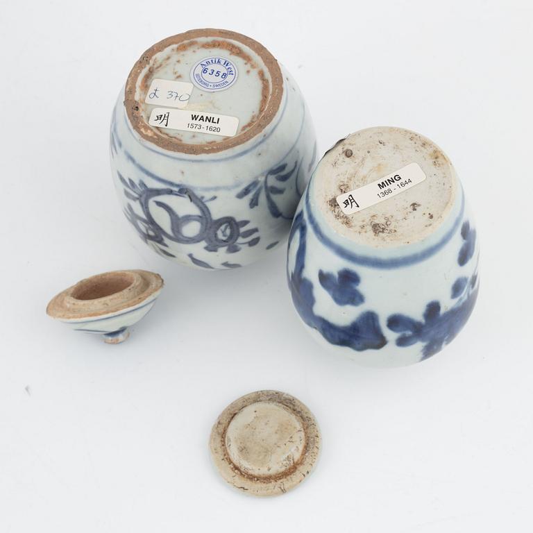 Five blue and white porcelain and ceramic urns, Ming dynasty, (1368-1644).